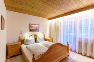 Postel nebo postele na pokoji v ubytování Apartmenthaus Jagdhof
