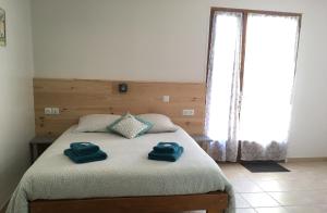 Postel nebo postele na pokoji v ubytování Le Mas des 3 Anes