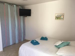 Postel nebo postele na pokoji v ubytování Le Mas des 3 Anes