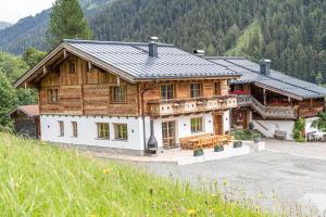 a large wooden house in the mountains at Maroldenhof in Saalbach Hinterglemm
