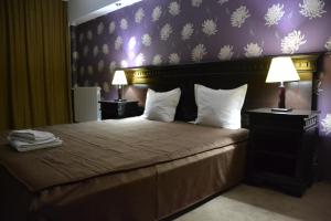 Postel nebo postele na pokoji v ubytování Hotel Condor