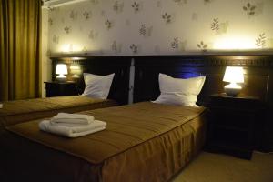 Postel nebo postele na pokoji v ubytování Hotel Condor