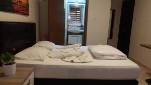 Postel nebo postele na pokoji v ubytování Hotel Kiwi