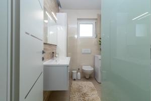 Kúpeľňa v ubytovaní Apartman Tragos