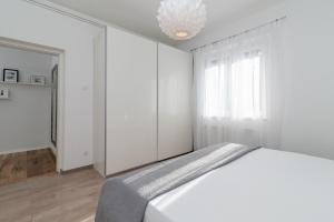 Posteľ alebo postele v izbe v ubytovaní Apartman Tragos