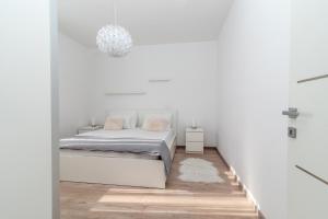 Posteľ alebo postele v izbe v ubytovaní Apartman Tragos
