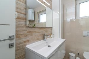 Kúpeľňa v ubytovaní Apartman Tragos