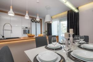 Kuchyňa alebo kuchynka v ubytovaní Apartman Tragos