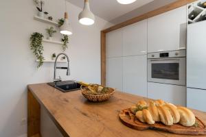Kuchyňa alebo kuchynka v ubytovaní Apartman Tragos