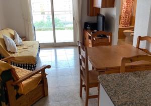 a living room with a table and a dining room at Napoles LMPRC 014 in San Blas