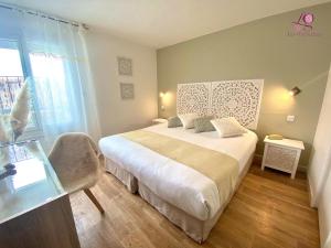 Postel nebo postele na pokoji v ubytování Hotel Les Grenadines