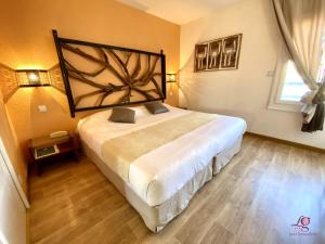 Postel nebo postele na pokoji v ubytování Hotel Les Grenadines