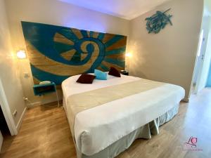 Postel nebo postele na pokoji v ubytování Hotel Les Grenadines