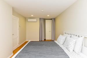 Postel nebo postele na pokoji v ubytování Irklo apartamentai su vaizdu į jūrą