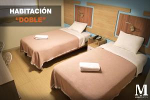 Letto o letti in una camera di Hotel Mega