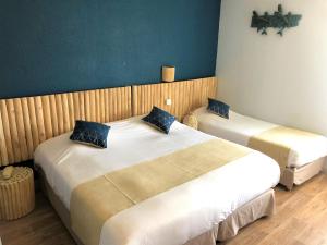 Postel nebo postele na pokoji v ubytování Hotel Les Grenadines
