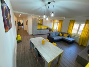 a living room with a table and a couch at VANNUCCI 71 APT in Perugia