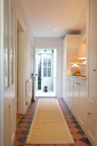 a hallway with aoyer with a dog in the doorway at Seventeen The Town House Bath in Bath