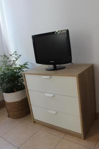 Televízia a/alebo spoločenská miestnosť v ubytovaní Casa Vacanze Giorgetta 2-3 piano
