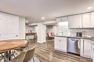 a kitchen and dining room with a table and chairs at Cozy-Chic Cincy Apartment Less Than 4 Mi to Dtwn and Stadium in Cincinnati