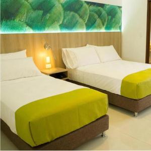 Кровать или кровати в номере Kau Hotel