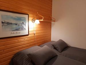 Postel nebo postele na pokoji v ubytování Lapin Kutsu Luulampi Apartments