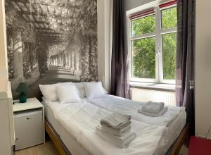 Posteľ alebo postele v izbe v ubytovaní VULTOR Apartments