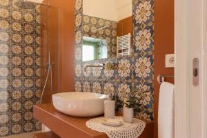 a bathroom with a sink and a mirror at PaolOttaviA in Monopoli +37 photos