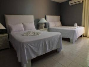 Postel nebo postele na pokoji v ubytování Hotel Maracas Punta Cana