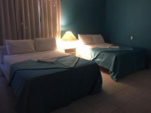 Postel nebo postele na pokoji v ubytování Hotel Maracas Punta Cana