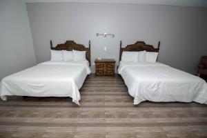 Postel nebo postele na pokoji v ubytování Hotel Posada Tierra Blanca