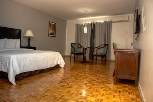 Postel nebo postele na pokoji v ubytování Hotel Posada Tierra Blanca