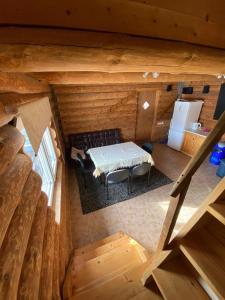 an overhead view of a room in a log cabin at Avoti in Jūrkalne