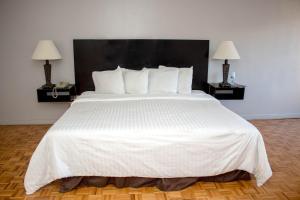 Postel nebo postele na pokoji v ubytování Hotel Posada Tierra Blanca
