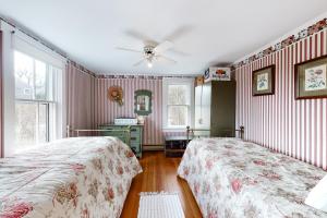 The Rose Cottage tesisinde bir odada yatak veya yataklar
