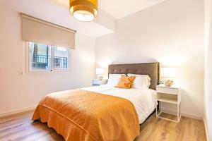 מיטה או מיטות בחדר ב-Apartamentos palangreros