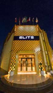 a building with lights on the front of it at Elite Najran in Najran