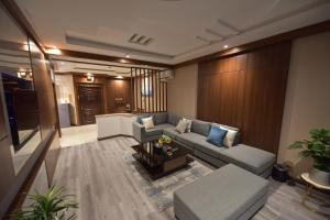 a living room with a couch and a table at Elite Najran in Najran