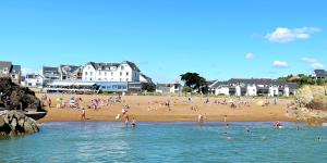 a beach with a bunch of people on it at AZUR in Saint-Nazaire