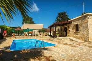 The swimming pool at or close to Karydhia Cottage