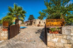 a sign for a marriott courtyard at a house at Karydhia Cottage in Pano Arodes