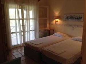 A bed or beds in a room at Villa Bouboule