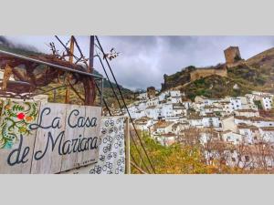 a sign for la coca cola ad marina on a mountain at La Casa De Mariana in Cazorla