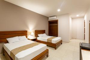 Voodi või voodid majutusasutuse Xuux Peek by Tecnohotel toas