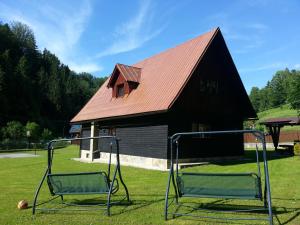 two golf carts in front of a barn at Chata Sipkova I in Terchová
