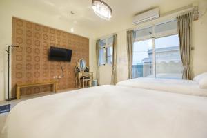 Postel nebo postele na pokoji v ubytování Square B&B