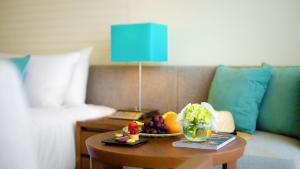 a room with a table with fruits and vegetables on it at ANA InterContinental Manza Beach Resort, an IHG Hotel in Onna