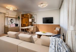 a living room with a couch and a table at Mantra Terrace Brisbane in Brisbane