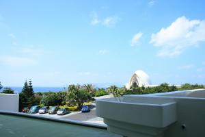 a view from a balcony of a parking lot at ANA InterContinental Manza Beach Resort by IHG in Onna