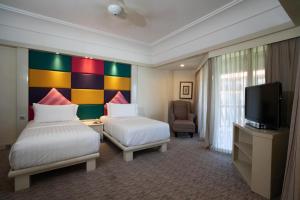 Кровать или кровати в номере The Magellan Sutera Resort